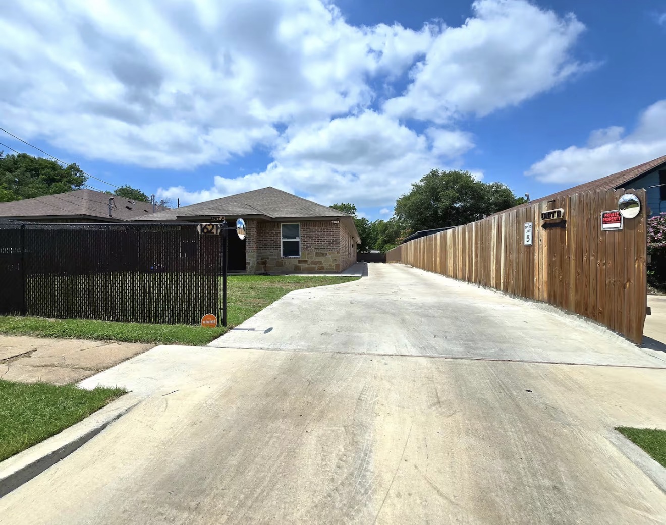Rear driveway view of Toujours Prêt Place